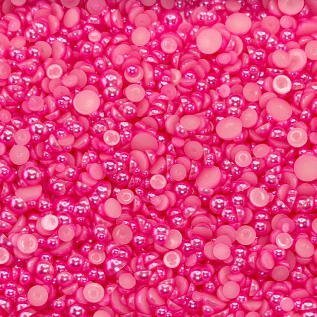 A close-up view of Popsicle Pink acrylic flat-back baubles embellishment mix, predominantly in shades of pink.