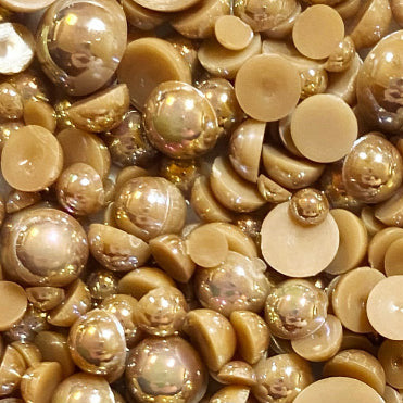 A close-up view of a mix of acrylic flat-back beads in brown, beige, and white colors, labeled as 'Lovely Latte Acrylic Flat-back Baubles Embellishment Mix'.